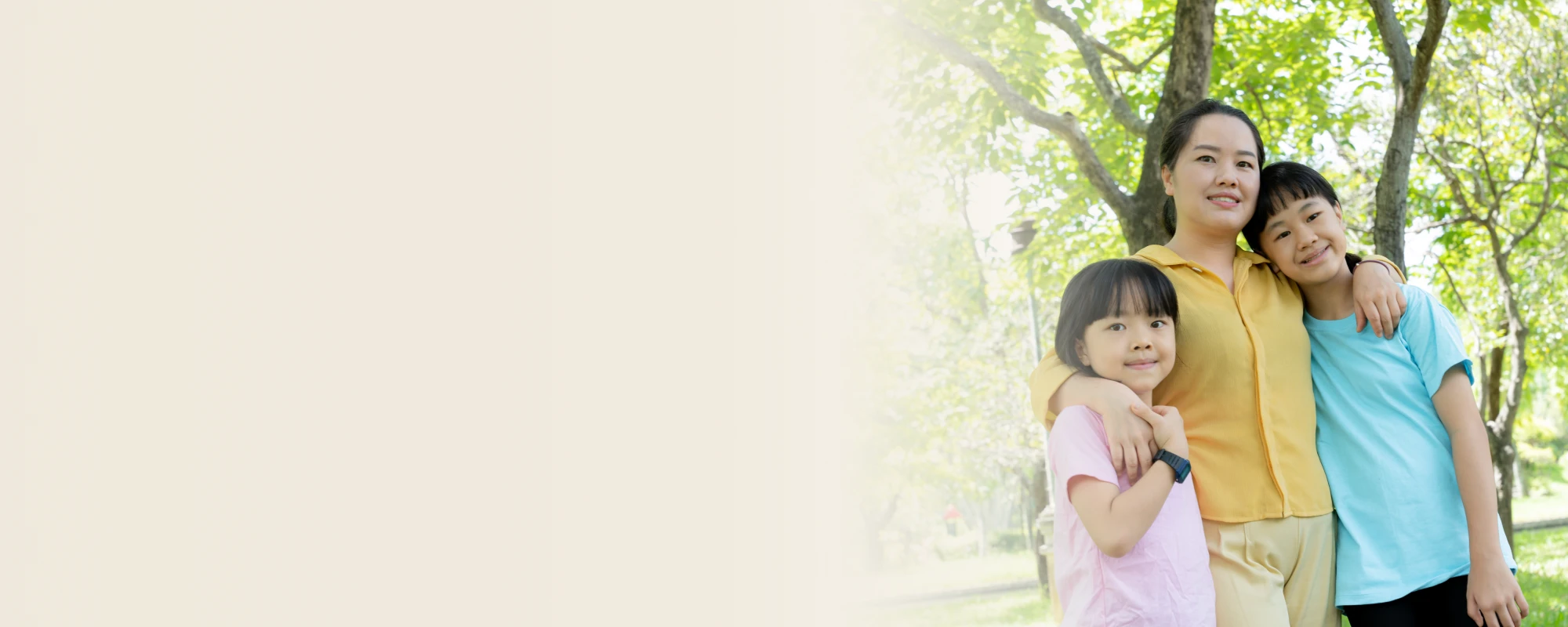 Kids in in colorful t-shirts smiling gently 