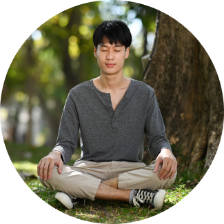 A man sitting under a tree - Meditating